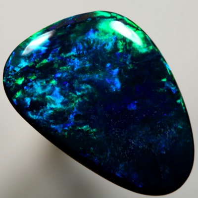 SOLID BLACK OPAL Gem quality opal. Bright strong peacock fire in a Flame pattern SEE VIDEO